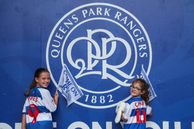 Queens Park Rangers fans arrive at Matrade Loftus Road Stadium prior to the Sky Bet Championship match Queens Park Rangers vs West Bromwich Albion at Kiyan Prince Foundation Stadium, London, United Kingdom, 10th August 2024 clipart