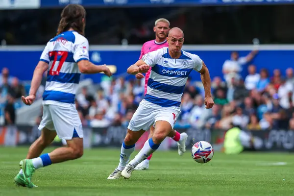 stock image Michael Frey of Queens Park Rangers runs with the ball during the Sky Bet Championship match Queens Park Rangers vs West Bromwich Albion at Kiyan Prince Foundation Stadium, London, United Kingdom, 10th August 2024