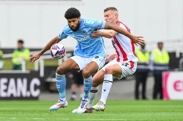 stock image Ellis Simms of Coventry City holds off Ben Gibson of Stoke City during the Sky Bet Championship match Stoke City vs Coventry City at Bet365 Stadium, Stoke-on-Trent, United Kingdom, 10th August 2024