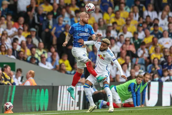 Stock image Connor Ogilvie of Portsmouth fouled by Jayden Bogle of Leeds United during the Sky Bet Championship match Leeds United vs Portsmouth at Elland Road, Leeds, United Kingdom, 10th August 2024