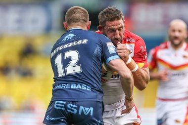 Julian Bousquet of Catalan Dragons is tackled by James Batchelor of Hull KR during the Magic Weekend match Catalans Dragons vs Hull KR at Elland Road, Leeds, United Kingdom, 18th August 2024 clipart