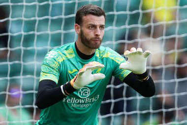 Norwich City 'den Angus Gunn, 17 Ağustos 2024' te Norwich City 'nin Carrow Road, Norwich' te Blackburn Rovers 'a karşı oynadığı Gökyüzü İddia Şampiyonası karşılaşmasından önce ısınıyor.