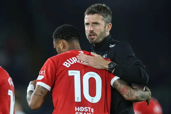 stock image Michael Carrick manager of Middlesbrough embraces Delano Burgzorg of Middlesbrough after the game during the Carabao Cup match Leeds United vs Middlesbrough at Elland Road, Leeds, United Kingdom, 14th August 2024