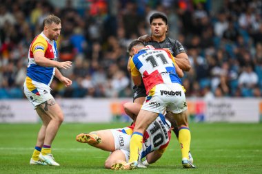 Herman Eseese Hull FC is tackled by Lewis Bienek of London Broncos and Will Lovell of London Broncos during the Magic Weekend match Hull FC vs London Broncos at Elland Road, Leeds, United Kingdom, 17th August 2024 clipart