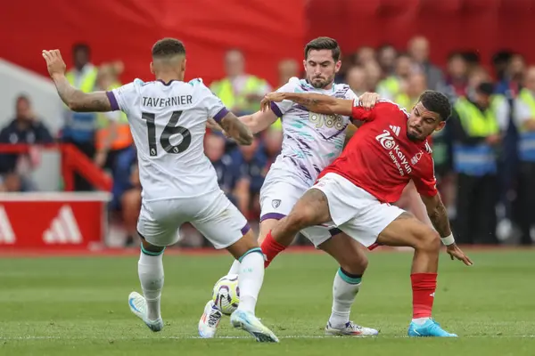 stock image Marcus Tavernier of Bournemouth and Lewis Cook of Bournemouth pressure Morgan Gibbs-White of Nottingham Forest during the Premier League match Nottingham Forest vs Bournemouth at City Ground, Nottingham, United Kingdom, 17th August 2024