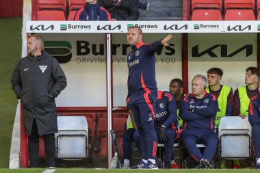 Travis Binnion Manager of Manchester United U21's gives his team instructions during the Bristol Street Motors Trophy match Barnsley vs Manchester United U21 at Oakwell, Barnsley, United Kingdom, 20th August 2024 clipart