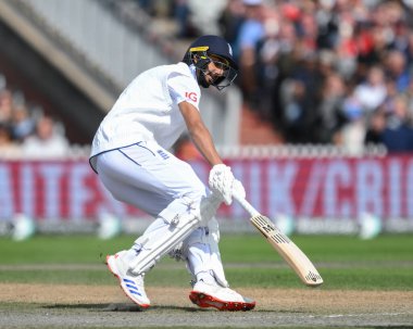 Shoaib Bashir of England reaches for the crease during the England Men v Sri Lanka 1st Rothesay Test Match Day 3 at Old Trafford, Manchester, United Kingdom, 23rd August 2024 clipart