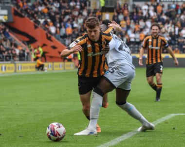 Will Jarvis of Hull is fouled by Romain Esse of Millwall during the Sky Bet Championship match Hull City vs Millwall at MKM Stadium, Hull, United Kingdom, 24th August 2024 clipart