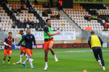 Elkan Baggott of Blackpool during the pre-game warm up ahead of the Sky Bet League 1 match Cambridge United vs Blackpool at Abbey Stadium, Cambridge, United Kingdom, 24th August 2024 clipart