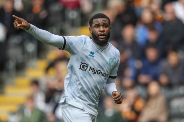 Japhet Tanganga of Millwall gives his team instructions during the Sky Bet Championship match Hull City vs Millwall at MKM Stadium, Hull, United Kingdom, 24th August 2024 clipart