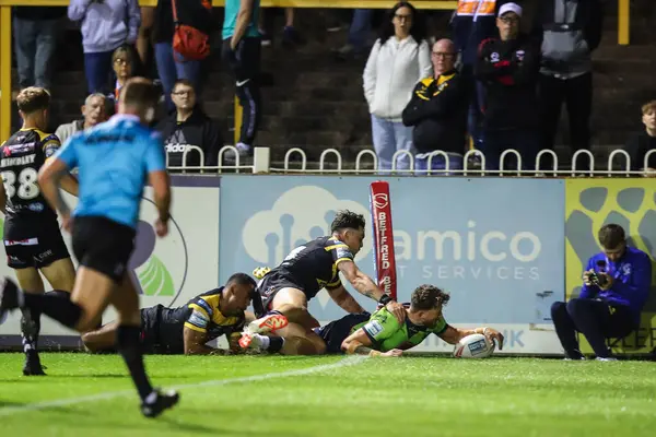 stock image Matty Ashton of Warrington Wolves goes over for a try and makes the score 6-22 during the Betfred Super League Round 23 match Castleford Tigers vs Warrington Wolves at The Mend-A-Hose Jungle, Castleford, United Kingdom, 23rd August 2024