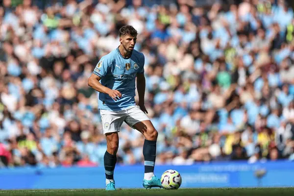 stock image Rben Dias of Manchester City with the ball during the Premier League match Manchester City vs Ipswich Town at Etihad Stadium, Manchester, United Kingdom, 24th August 2024