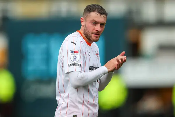 stock image Elliot Embleton of Blackpool applauds the travelling fans after the Sky Bet League 1 match Cambridge United vs Blackpool at Abbey Stadium, Cambridge, United Kingdom, 24th August 2024