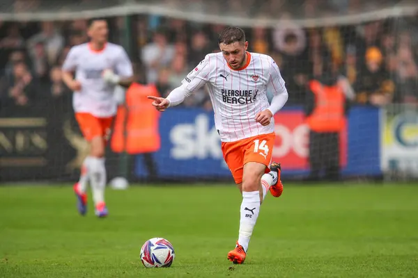 stock image Elliot Embleton of Blackpool goes forward with the ball during the Sky Bet League 1 match Cambridge United vs Blackpool at Abbey Stadium, Cambridge, United Kingdom, 24th August 2024