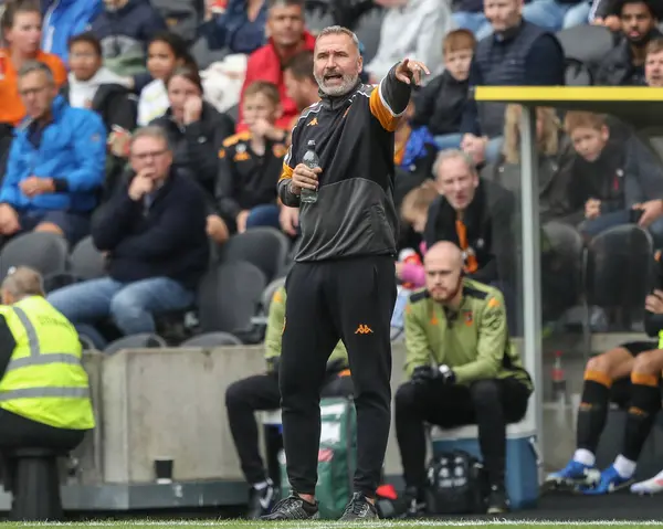 Stock image Tim Walter manager of Hull City gives his team instructions during the Sky Bet Championship match Hull City vs Millwall at MKM Stadium, Hull, United Kingdom, 24th August 2024