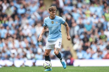 Manchester City 'den John Stones Premier League maçında topla birlikte Manchester City - Ipswich Town, Etihad Stadyumu, Manchester, Birleşik Krallık, 24 Ağustos 2024