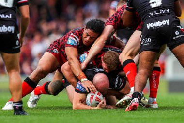 Lee Kershaw of London Broncos is tackled during the Betfred Super League Round 23 match London Broncos vs Leigh Leopards at Plough Lane, Wimbledon, United Kingdom, 25th August 2024 clipart