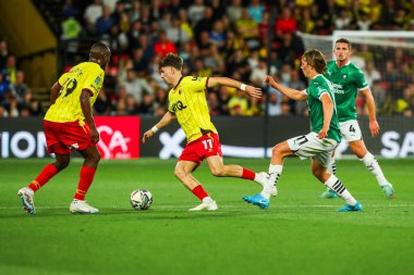 Rocco Vata of Watford is put under pressure by Callum Wright of Plymouth Argyle during the Carabao Cup match Watford vs Plymouth Argyle at Vicarage Road, Watford, United Kingdom, 27th August 2024 clipart