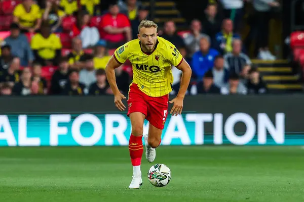 stock image Ryan Porteous of Watford runs with the ball during the Carabao Cup match Watford vs Plymouth Argyle at Vicarage Road, Watford, United Kingdom, 27th August 202