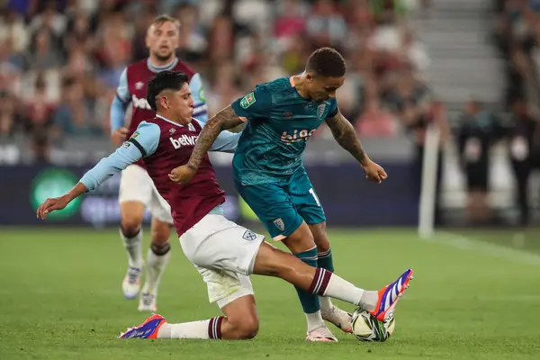 stock image Marcus Tavernier of Bournemouth is tackled by Edson lvarez of West Ham United during the Carabao Cup match West Ham United vs Bournemouth at London Stadium, London, United Kingdom, 28th August 2024