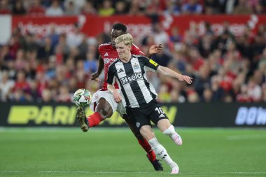 Willy Boly of Nottingham Forest and Anthony Gordon of Newcastle United battle for the ball during the Carabao Cup match Nottingham Forest vs Newcastle United at City Ground, Nottingham, United Kingdom, 28th August 2024 clipart