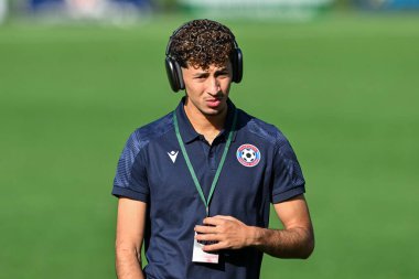 Amine Benchaib of FK Panevys inspects the pitch ahead of the UEFA Conference League match The New Saints vs FK Panevys at Park Hall Stadium, Oswestry, United Kingdom, 29th August 2024 clipart