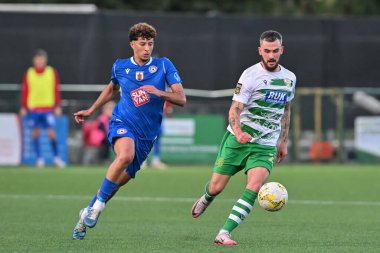 Leo Smith of The New Saints and Amine Benchaib of FK Panevys chases down the ball during the UEFA Conference League match The New Saints vs FK Panevys at Park Hall Stadium, Oswestry, United Kingdom, 29th August 2024 clipart