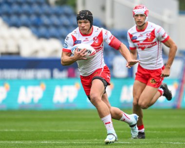 Jonny Lomax of St. Helens makes a break during the Betfred Super League Round 24 match Huddersfield Giants vs St Helens at John Smith's Stadium, Huddersfield, United Kingdom, 1st September 2024 clipart