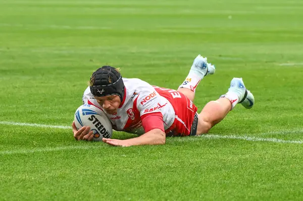 stock image Jonny Lomax of St. Helens goes over for a try during the Betfred Super League Round 24 match Huddersfield Giants vs St Helens at John Smith's Stadium, Huddersfield, United Kingdom, 1st September 2024