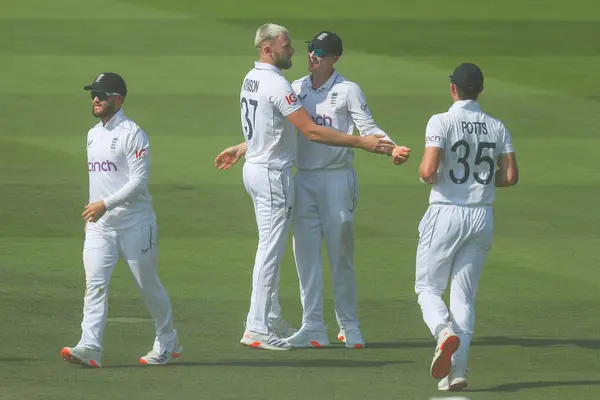 stock image Gus Atkinson of England celebrates with teammates after the dismissal of Dinesh Chandimal of Sri Lanka during the England v Sri Lanka 2nd Rothesay Test Match Day 4 at Lords, London, United Kingdom, 1st September 2024