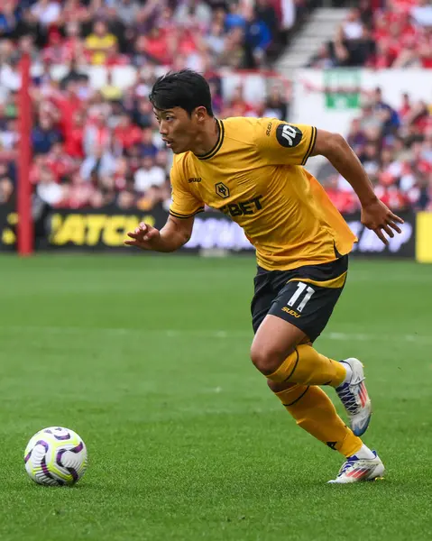 stock image Hwang Hee-Chan of Wolverhampton Wanderers makes a break with the ball  during the Premier League match Nottingham Forest vs Wolverhampton Wanderers at City Ground, Nottingham, United Kingdom, 31st August 2024