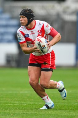 Jonny Lomax of St. Helens makes a break during the Betfred Super League Round 24 match Huddersfield Giants vs St Helens at John Smith's Stadium, Huddersfield, United Kingdom, 1st September 2024 clipart