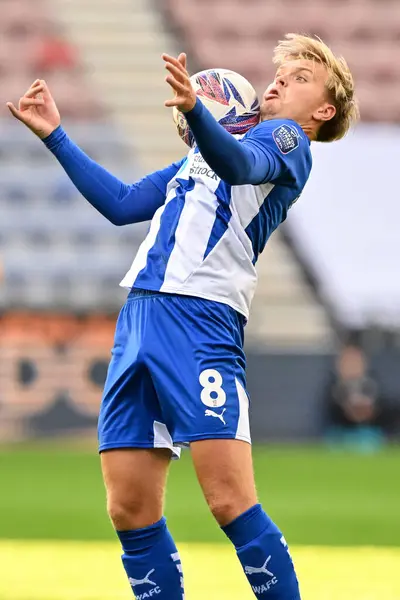 stock image Matt Smith of Wigan Athletic brings the ball under control during the Bristol Street Motors Trophy match Wigan Athletic vs Morecambe at DW Stadium, Wigan, United Kingdom, 3rd September 2024