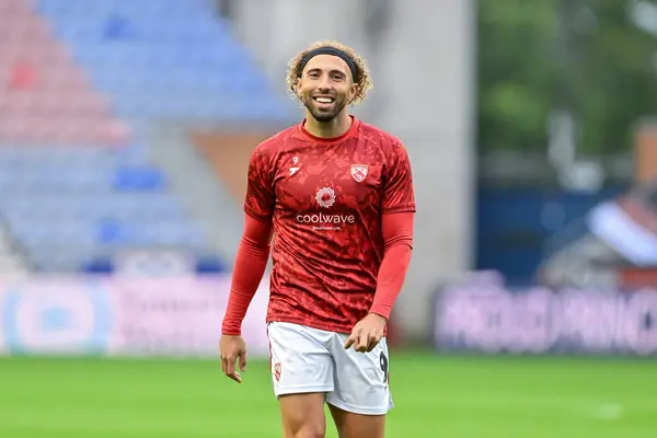 stock image Hallam Hope of Morecambe all smiles as he warms up ahead of the Bristol Street Motors Trophy match Wigan Athletic vs Morecambe at DW Stadium, Wigan, United Kingdom, 3rd September 2024