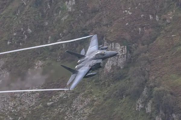 stock image USAF McDonnell Douglas F-15 Eagle on a low level training sortie in LFA 7 also known as the Mach Loop near Dolgellau, United Kingdom, 4th September 2024