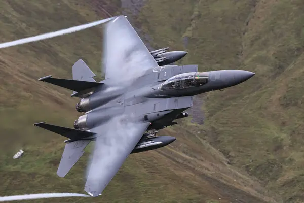 stock image USAF McDonnell Douglas F-15 Eagle on a low level training sortie in LFA 7 also known as the Mach Loop near Dolgellau, United Kingdom, 4th September 2024