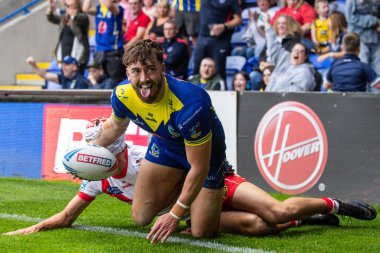 Warrington Wolves 'tan Matty Ashton, 7 Eylül 2024' te İngiltere 'nin Warrington kentinde oynanan 25. Warrington Wolves-St Helens maçında 4-2' lik Betfred Süper Ligi karşılaşmasını kutluyor.