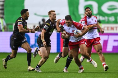 Ryan Hall of Hull KR is tackled by Abbas Miski of Wigan Warriors  during the Betfred Super League Rou4nd 25 match Wigan Warriors vs Hull KR at The Brick Community Stadium, Wigan, United Kingdom, 6th September 202 clipart