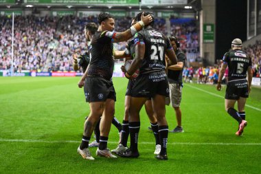 Wigan Warriors 'dan Junior Nsemba, 6 Eylül 2024' te Wigan Warriors vs Hull KR 'a karşı oynadığı Betfred Süper Lig karşılaşmasında şansını kutluyor.