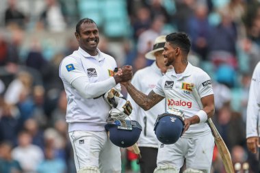 Angelo Mathews of Sri Lanka and Pathum Nissanka of Sri Lanka celebrate winning the test during the 3rd Rothesay Test Match Day Four England v Sri Lanka at The Kia Oval, London, United Kingdom, 9th September 2024 clipart