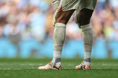 Manchester City kalecisi Ederson 'ın Premier League maçında giydiği futbol ayakkabıları ve çorapları Manchester City ile Brentford arasında 14 Eylül 2024' te Etihad Stadyumu 'nda oynanmıştır.