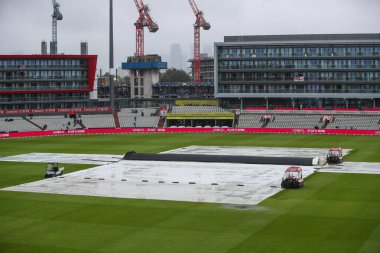 A general view inside of Old Trafford with the rain covers on as rain continues to fall ahead of the Third Vitality IT20 Series match England vs Australia at Old Trafford, Manchester, United Kingdom, 15th September 2024 clipart