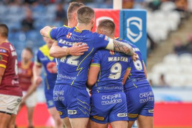 George Williams of Warrington Wolves celebrates his try during the Betfred Super League Round 26 match Huddersfield Giants vs Warrington Wolves at John Smith's Stadium, Huddersfield, United Kingdom, 14th September 2024 clipart