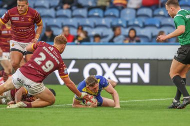 Matty Nicholson of Warrington Wolves goes over for a try during the Betfred Super League Round 26 match Huddersfield Giants vs Warrington Wolves at John Smith's Stadium, Huddersfield, United Kingdom, 14th September 2024 clipart