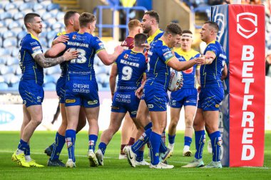 Warrington Wolves 'tan George Williams, 14 Eylül 2024' te John Smith 'in Stadyumu' nda oynanan Betfred Süper Lig 26. Maçı 'nda Huddersfield Giants' a karşı Warrington Wolves maçını kutluyor.