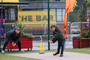 Young fans play cricket whilst waiting for play ahead of the Third Vitality IT20 Series match England vs Australia at Old Trafford, Manchester, United Kingdom, 15th September 2024 clipart