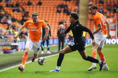 Gabriel Otegbayo of Sheffield Wednesday tackles Elliot Embleton of Blackpool during the Carabao Cup match Blackpool vs Sheffield Wednesday at Bloomfield Road, Blackpool, United Kingdom, 17th September 2024 clipart