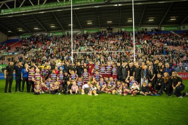 Wigan Warriors celebrate winning the League Leaders Shield infant of their fans after the Betfred Super League Round 27 match Wigan Warriors vs Salford Red Devils at The Brick Community Stadium, Wigan, United Kingdom, 19th September 2024 clipart