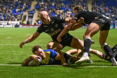 Warrington Wolves 'tan Matty Ashton, 20 Eylül 2024' te Halliwell Jones Stadyumu, Warrington 'da oynanan 27. Warrington Wolves-London Broncos maçında bir hat-trick yapmak için sahaya çıkıyor.