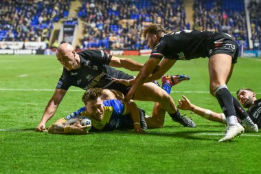 Warrington Wolves 'tan Matty Ashton, 20 Eylül 2024' te Halliwell Jones Stadyumu, Warrington 'da oynanan 27. Warrington Wolves-London Broncos maçında bir hat-trick yapmak için sahaya çıkıyor.